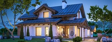Casa moderna luminata eficient pe timp de seara, alimentata prin reteaua electrica de la Retele Electrice
